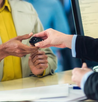 Woman On Business Trip Hiring A Car