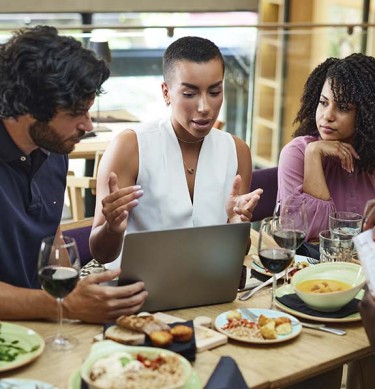 Business Professionals in Meeting at Lunch