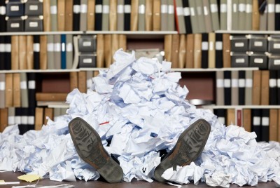 Business-traveler-buried-in-expense-receipts..jpg