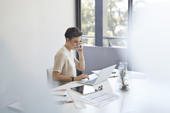 Woman on Phone and Computer